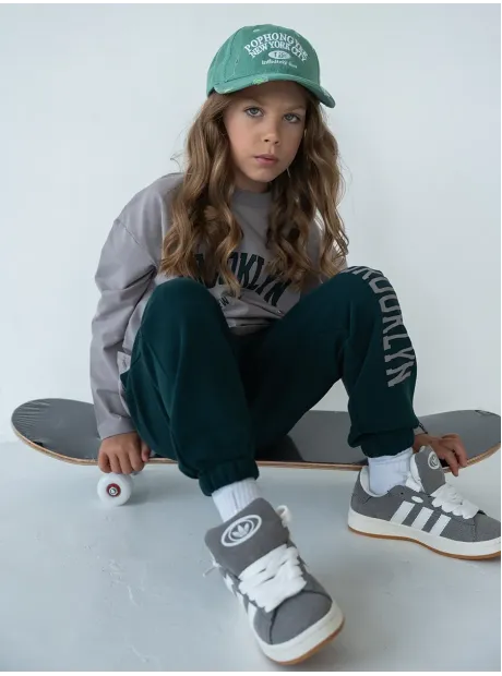 Зеленый спортивный костюм для девочки