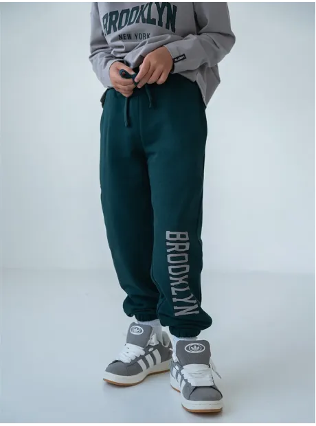 Зеленый спортивный костюм для девочки