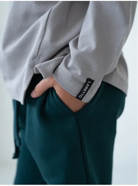 Зеленый спортивный костюм для девочки